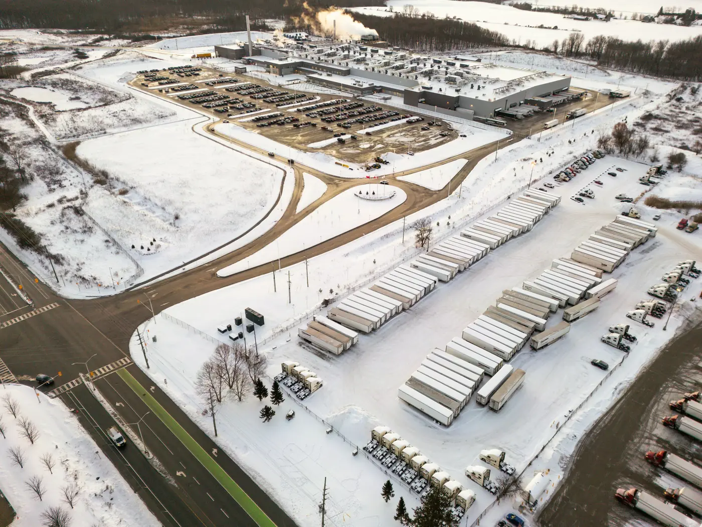 Aerial view of refrigerated trailers parked in a snow-covered yard